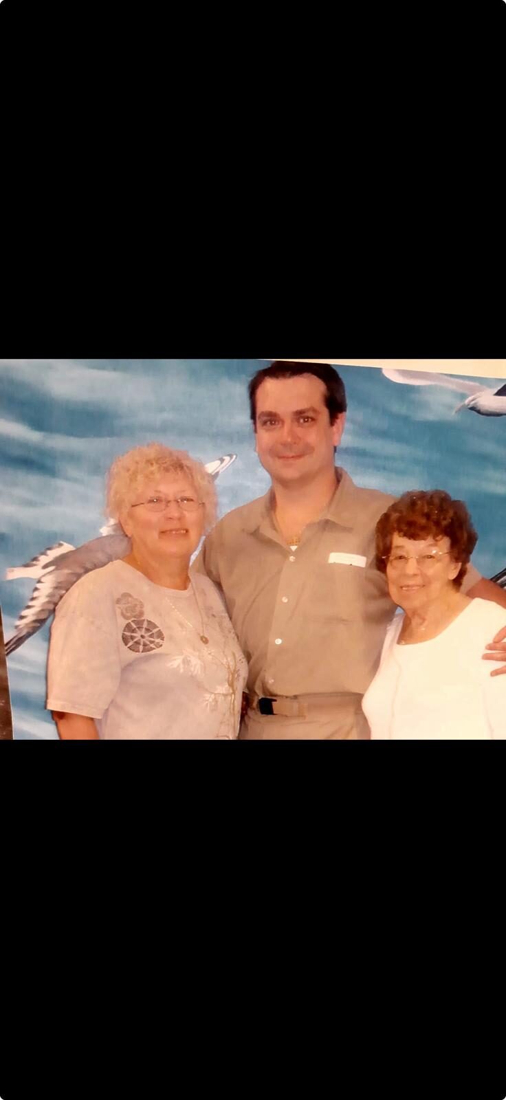 Gregory with two family members during a visit